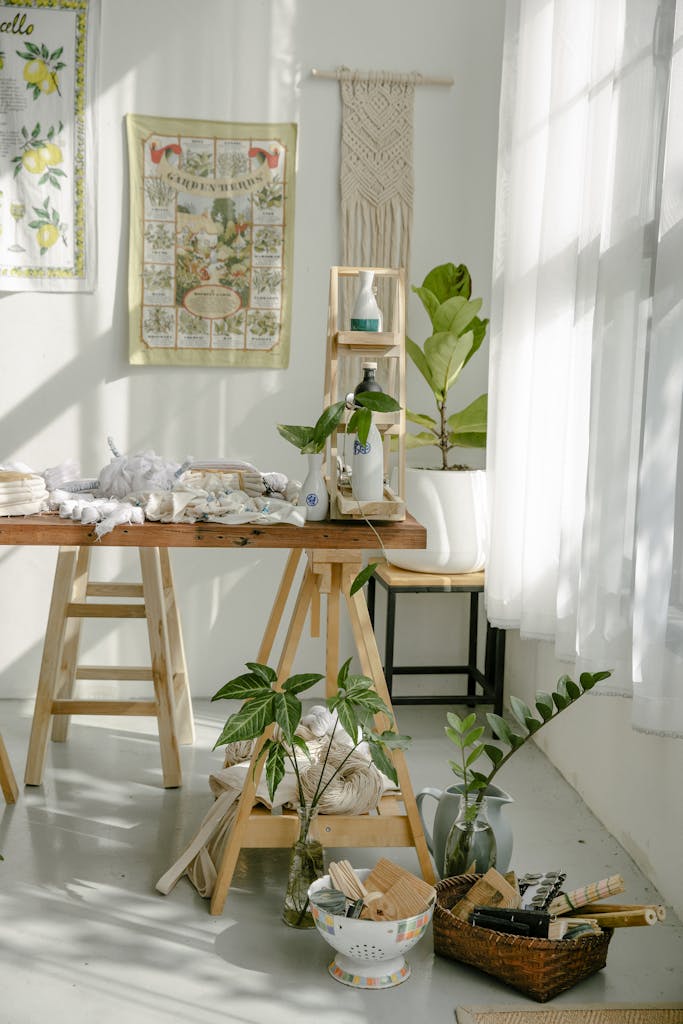 Sunlit artisan studio with plants and textiles, featuring a modern and minimalist design.