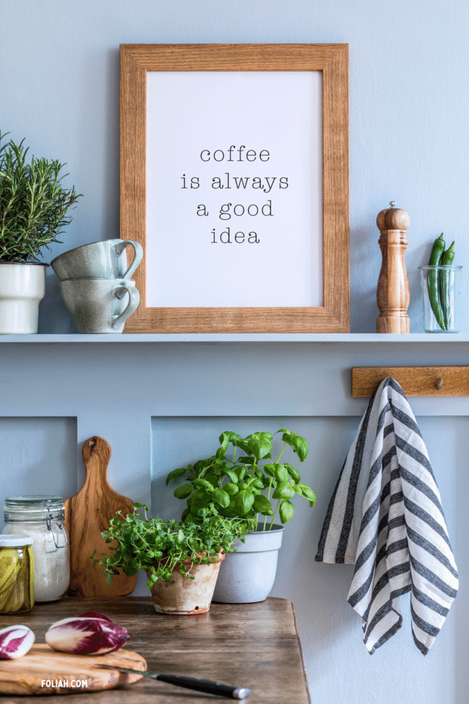 13 Gorgeous Kitchen Plant Styling Ideas You’ll Want to Copy 11 at Foliah Kitchen shelf with framed coffee quote, potted basil and thyme, fresh vegetables on a wooden bench, and simple modern home décor.